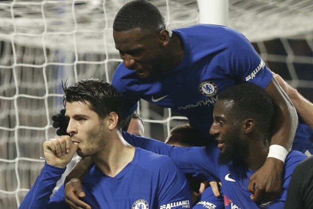 Chelsea's Alvaro Morata, left celebrates with his teammates after scoring his sides second goal of the game during the English League Cup quarterfinal soccer match between Chelsea and Bournemouth at Stamford Bridge stadium in London, Wednesday, Dec. 20, 2017.Chelsea won the game 2-1. (AP Photo/Alastair Grant)