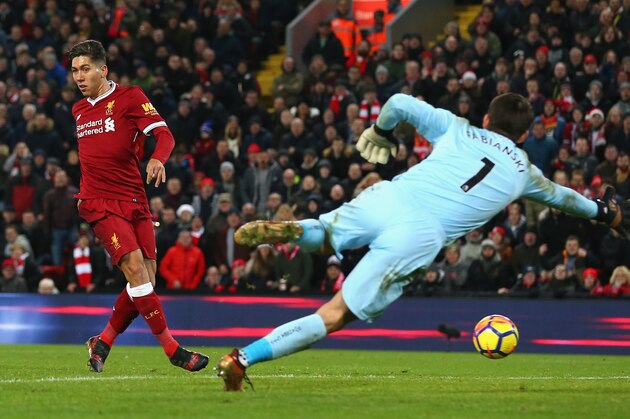 LIVERPOOL, ENGLAND - DECEMBER 26:  Roberto Firmino of Liverpool scores his second and his sides fourth goal during the Premier League match between Liverpool and Swansea City at Anfield on December 26, 2017 in Liverpool, England.  (Photo by Jan Kruger/Getty Images)