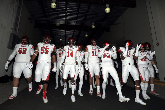 DALLAS, TX - DECEMBER 26:  The Utah Utes walk to the field before Zaxby's Heart of Dallas Bowl against the West Virginia Mountaineers on December 26, 2017 at Cotton Bowl in Dallas, Texas.  (Photo by Ronald Martinez/Getty Images)