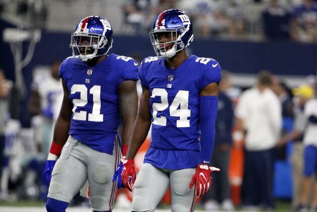 New York Giants' Landon Collins (21) and Eli Apple (24) walk up to the line of scrimmage in the first half of an NFL football game against the Dallas Cowboys on Sunday, Sept. 10, 2017, in Arlington, Texas. (AP Photo/Michael Ainsworth)