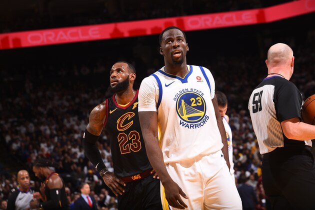 OAKLAND, CA - DECEMBER 25:   LeBron James #23 of the Cleveland Cavaliers and Draymond Green #23 of the Golden State Warriors look on during the game on December 25, 2017 at ORACLE Arena in Oakland, California. NOTE TO USER: User expressly acknowledges and agrees that, by downloading and or using this photograph, user is consenting to the terms and conditions of Getty Images License Agreement. Mandatory Copyright Notice: Copyright 2017 NBAE (Photo by Noah Graham/NBAE via Getty Images)