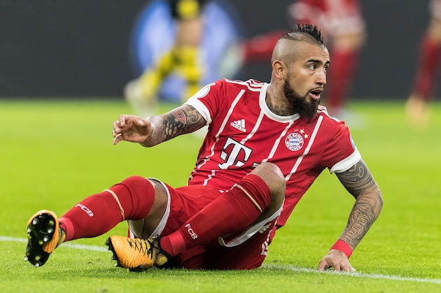 MUNICH, GERMANY - DECEMBER 20:  Arturo Vidal of FC Bayern Muenchen sits on the pitch during the DFB Cup match between Bayern Muenchen and Borussia Dortmund at Allianz Arena on December 20, 2017 in Munich, Germany.  (Photo by Boris Streubel/Getty Images)