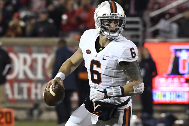 Virginia quarterback Kurt Benkert (6) rolls out of the pocket during the second half of an NCAA college football game against Louisville, Saturday, Nov. 11, 2017, in Louisville, Ky. Louisville won 38-21. (AP Photo/Timothy D. Easley)