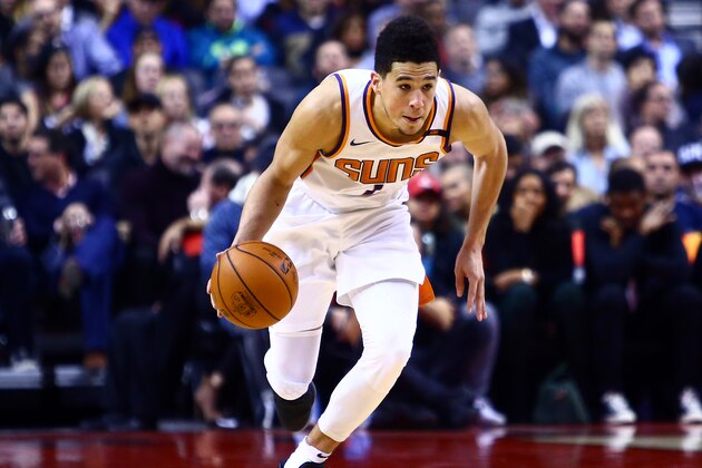 TORONTO, ON - December 05:  Devin Booker #1 of the Phoenix Suns dribbles the ball during the second half of an NBA game against the Toronto Raptors at Air Canada Centre on December 5, 2017 in Toronto, Canada.  NOTE TO USER: User expressly acknowledges and agrees that, by downloading and or using this photograph, User is consenting to the terms and conditions of the Getty Images License Agreement.  (Photo by Vaughn Ridley/Getty Images)