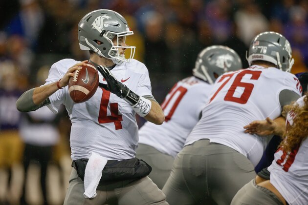 SEATTLE, WA - NOVEMBER 25:  Quarterback Luke Falk #4 of the Washington State Cougars passes against the Washington Huskies at Husky Stadium on November 25, 2017 in Seattle, Washington.  (Photo by Otto Greule Jr/Getty Images)