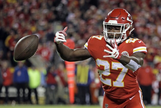 Kansas City Chiefs running back Kareem Hunt (27) follows an out of reach ball during the first half of an NFL football game against the Los Angeles Chargers in Kansas City, Mo., Saturday, Dec. 16, 2017. (AP Photo/Charlie Riedel)