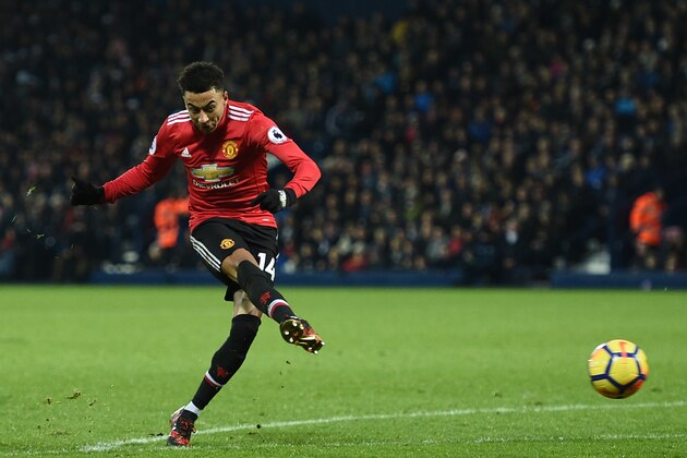 Manchester United's English midfielder Jesse Lingard has an unsuccessful shot during the English Premier League football match between West Bromwich Albion and Manchester United at The Hawthorns stadium in West Bromwich, central England, on December 17, 2017.
 / AFP PHOTO / Oli SCARFF / RESTRICTED TO EDITORIAL USE. No use with unauthorized audio, video, data, fixture lists, club/league logos or 'live' services. Online in-match use limited to 75 images, no video emulation. No use in betting, games or single club/league/player publications.  /         (Photo credit should read OLI SCARFF/AFP/Getty Images)