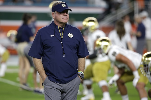 FILE - In this Nov. 11, 2017, file photo, Notre Dame head coach Brian Kelly walks on the field before an NCAA college football game against Miami in Miami Gardens, Fla. The game between No. 9 Notre Dame and No. 20 Stanford may not carry the pomp and circumstances of some previous meetings, but it does give Irish coach Brian Kelly his latest chance to complete an elusive mission: beat a ranked team on the road. (AP Photo/Lynne Sladky, File)