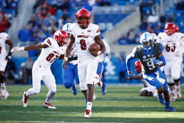 LEXINGTON, KY - NOVEMBER 25:  Lamar Jackson #8 of the Louisville Cardinals runs with the ball against the Kentucky Wildcats during the game at Commonwealth Stadium on November 25, 2017 in Lexington, Kentucky.  (Photo by Andy Lyons/Getty Images)