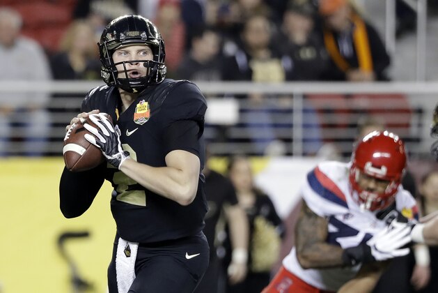 Purdue quarterback Elijah Sindelar, left, throws against Arizona during the first half of the Foster Farms Bowl NCAA college football game Wednesday, Dec. 27, 2017, in Santa Clara, Calif. (AP Photo/Marcio Jose Sanchez)