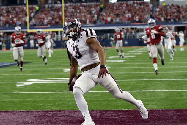 FILE - In this Saturday, Sept. 23, 2017, file photo, Texas A&M wide receiver Christian Kirk (3) celebrates in the end zone after returning a kick off 100 yards for a touchdown in the second half of an NCAA college football game against Arkansas in Arlington, Texas. Through Texas A&M's first three games many wondered if Kirk was frustrated as near-constant double teams kept him from posting the big numbers he had the past two seasons. That all changed on Saturday when he returned a kick 100 yards for a touchdown and had 110 yards receiving with two touchdowns in a win over Arkansas. (AP Photo/Tony Gutierrez, File)