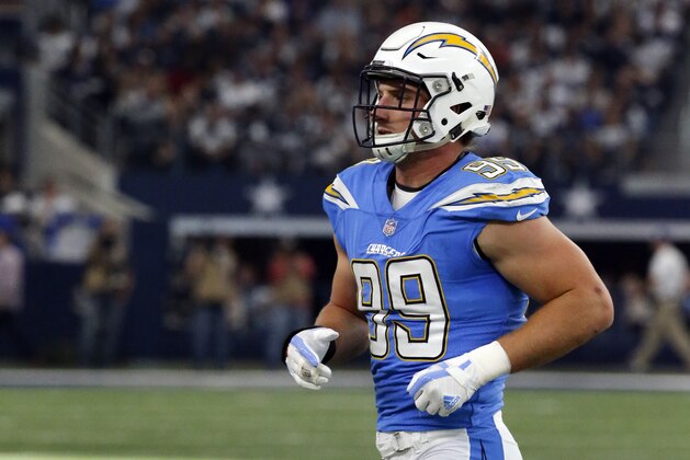 Los Angeles Chargers' Joey Bosa (99) jogs off the field during an NFL football game against the Dallas Cowboys on Thursday, Nov. 23, 2017, in Arlington, Texas. (AP Photo/Michael Ainsworth)