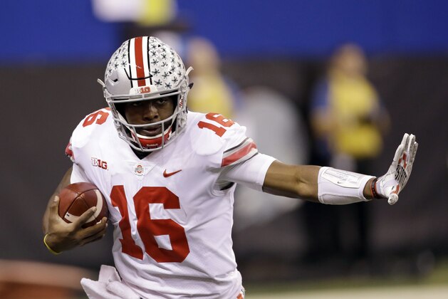 Ohio State quarterback J.T. Barrett runs with the ball during the first half the Big Ten championship NCAA college football game against Wisconsin, Saturday, Dec. 2, 2017, in Indianapolis. (AP Photo/AJ Mast)