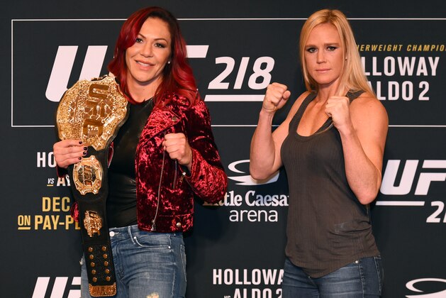 DETROIT, MI - NOVEMBER 30:  (L-R) Opponents Cris Cyborg of Brazil and Holly Holm pose for photos ahead of their UFC 219 fight during the UFC 218 Ultimate Media Day at the DoubleTree Hotel on November 30, 2017 in Detroit, Michigan. (Photo by Josh Hedges/Zuffa LLC via Getty Images)
