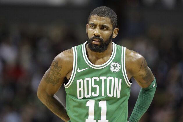Boston Celtics' Kyrie Irving (11) watches a free throw during the second half of an NBA basketball game against the Charlotte Hornets in Charlotte, N.C., Wednesday, Dec. 27, 2017. (AP Photo/Chuck Burton)