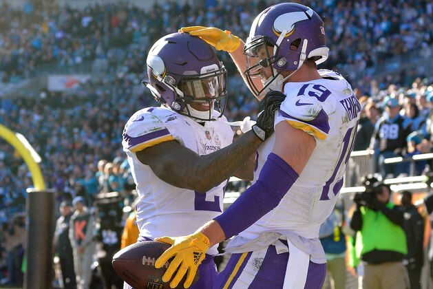 CHARLOTTE, NC - DECEMBER 10:  Adam Thielen #19 celebrates with Jerick McKinnon #21 of the Minnesota Vikings after scoring a touchdown against the Carolina Panthers during their game at Bank of America Stadium on December 10, 2017 in Charlotte, North Carolina.  (Photo by Grant Halverson/Getty Images)