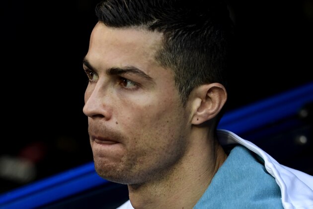 Real Madrid's Portuguese forward Cristiano Ronaldo looks on before the Spanish League 'Clasico' football match Real Madrid CF vs FC Barcelona at the Santiago Bernabeu stadium in Madrid on December 23, 2017.  / AFP PHOTO / JAVIER SORIANO        (Photo credit should read JAVIER SORIANO/AFP/Getty Images)