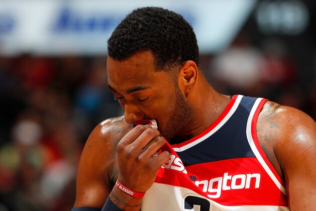 ATLANTA, GA - DECEMBER 27:  John Wall #2 of the Washington Wizards wipes his face during the game against the Atlanta Hawks at Philips Arena on December 27, 2017 in Atlanta, Georgia.  NOTE TO USER: User expressly acknowledges and agrees that, by downloading and or using this photograph, User is consenting to the terms and conditions of the Getty Images License Agreement.  (Photo by Kevin C. Cox/Getty Images)
