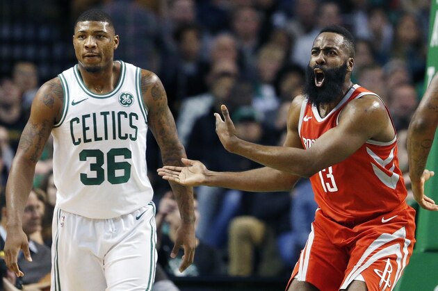 Houston Rockets' James Harden (13) protests a call beside Boston Celtics' Marcus Smart (36) during the first quarter of an NBA basketball game in Boston, Thursday, Dec. 28, 2017. (AP Photo/Michael Dwyer)