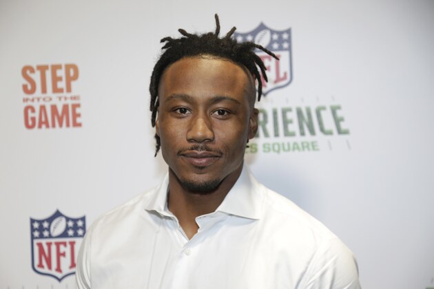 New York Giants Brandon Marshall poses for a picture at the opening of