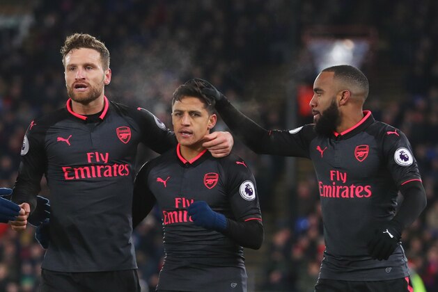 LONDON, ENGLAND - DECEMBER 28:  Alexis Sanchez of Arsenal (2R) celebrates as he scores their second goal with Granit Xhaka, Shkodran Mustafi and Alexandre Lacazette during the Premier League match between Crystal Palace and Arsenal at Selhurst Park on December 28, 2017 in London, England.  (Photo by Catherine Ivill/Getty Images)