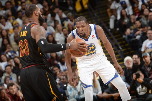 OAKLAND, CA - DECEMBER 25:  Kevin Durant #35 of the Golden State Warriors guards LeBron James #23 of the Cleveland Cavaliers on December 25, 2017 at ORACLE Arena in Oakland, California. NOTE TO USER: User expressly acknowledges and agrees that, by downloading and or using this photograph, user is consenting to the terms and conditions of Getty Images License Agreement. Mandatory Copyright Notice: Copyright 2017 NBAE (Photo by Noah Graham/NBAE via Getty Images)