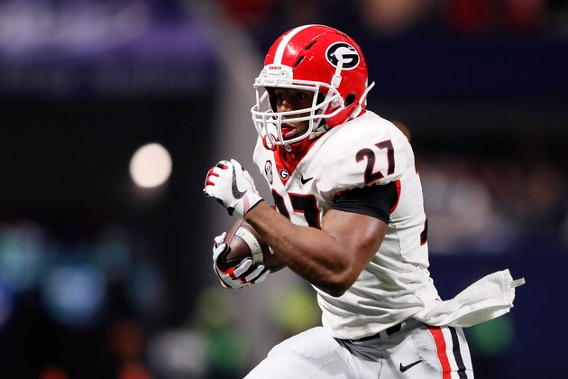 ATLANTA, GA - DECEMBER 02: Nick Chubb #27 of the Georgia Bulldogs runs the ball during the first half against the Auburn Tigers in the SEC Championship at Mercedes-Benz Stadium on December 2, 2017 in Atlanta, Georgia. (Photo by Jamie Squire/Getty Images)