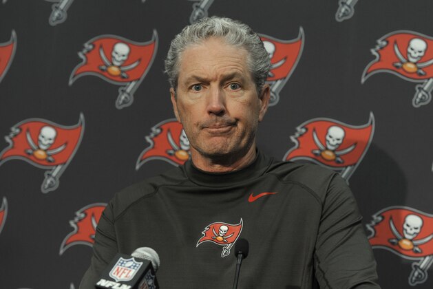 Tampa Bay Buccaneers head coach Dirk Koetter answers a question after an NFL football game against the Carolina Panthers in Charlotte, N.C., Sunday, Dec. 24, 2017. (AP Photo/Mike McCarn)