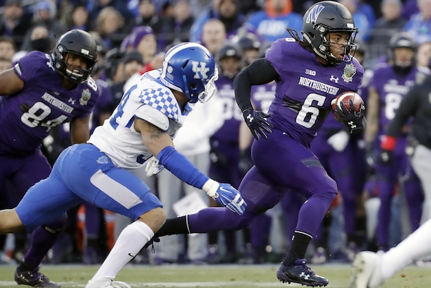 Northwestern wide receiver Jelani Roberts (6) carries the ball against Kentucky in the first half of the Music City Bowl NCAA college football game Friday, Dec. 29, 2017, in Nashville, Tenn. (AP Photo/Mark Humphrey)