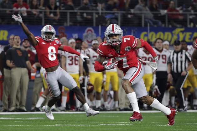Ohio State safety Damon Webb (7) runs an interception in for a touchdown in front of cornerback Kendall Sheffield (8) during the first half of the Cotton Bowl NCAA college football game against Southern California in Arlington, Texas, Friday, Dec. 29, 2017. (AP Photo/LM Otero) Ohio State safety Damon Webb (7) runs an interception in for a touchdown in front of cornerback Kendall Sheffield (8) during the first half of the Cotton Bowl NCAA college football game against Southern California in Arlington, Texas, Friday, Dec. 29, 2017. (AP Photo/LM Otero)