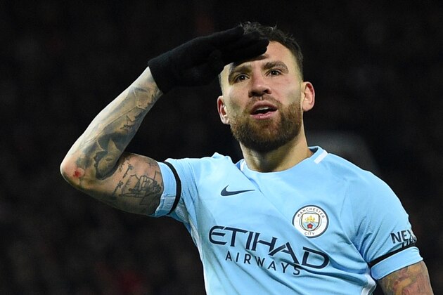 Manchester City's Argentinian defender Nicolas Otamendi celebrates scoring their second goal during the English Premier League football match between Manchester United and Manchester City at Old Trafford in Manchester, north west England, on December 10, 2017. / AFP PHOTO / Oli SCARFF / RESTRICTED TO EDITORIAL USE. No use with unauthorized audio, video, data, fixture lists, club/league logos or 'live' services. Online in-match use limited to 75 images, no video emulation. No use in betting, games or single club/league/player publications.  /         (Photo credit should read OLI SCARFF/AFP/Getty Images)