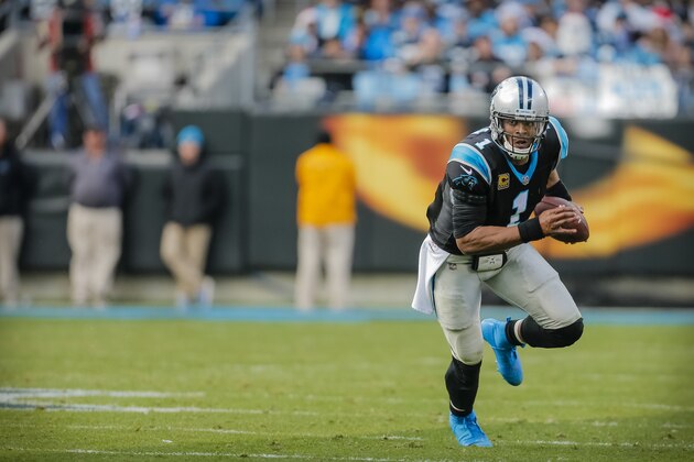 Carolina Panthers' Cam Newton (1) looks to gain on the Tampa Bay Buccaneers' defense during the second half of an NFL football game in Charlotte, N.C., Sunday, Dec. 24, 2017. The Panthers won 22-19. (AP Photo/Bob Leverone)