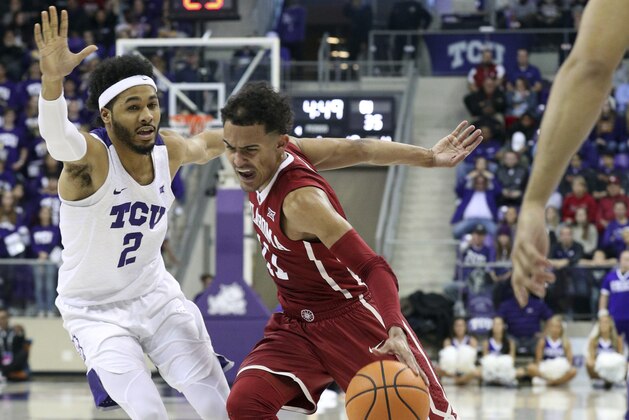TCU guard Shawn Olden (2) defends as Oklahoma guard Trae Young (11) drives past during an NCAA college basketball game, Saturday, Dec. 30, 2017. (AP Photo/ Richard W. Rodriguez)