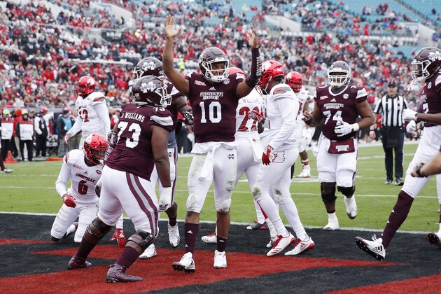 JACKSONVILLE, FL - DECEMBER 30: Keytaon Thompson #10 of the Mississippi State Bulldogs reacts after rushing for a 14-yard touchdown in the first quarter of the TaxSlayer Bowl against the Louisville Cardinals at EverBank Field on December 30, 2017 in Jacksonville, Florida. (Photo by Joe Robbins/Getty Images)