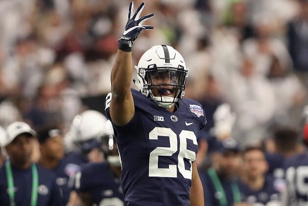 GLENDALE, AZ - DECEMBER 30:  Running back Saquon Barkley #26 of the Penn State Nittany Lions celebrates after scoring on a 92 yard touchdown rush against the Washington Huskies during the first half of the Playstation Fiesta Bowl at University of Phoenix Stadium on December 30, 2017 in Glendale, Arizona.  (Photo by Christian Petersen/Getty Images)