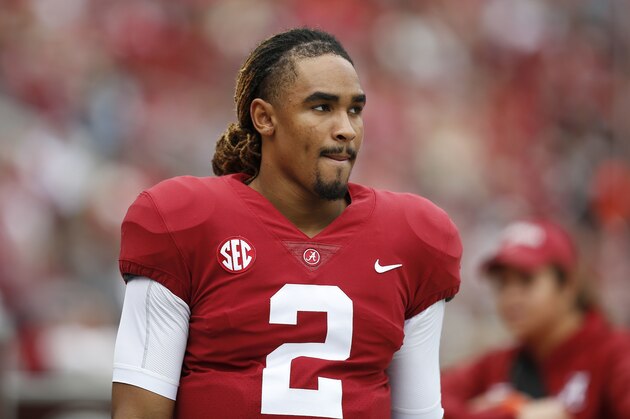Alabama quarterback Jalen Hurts talks with teammates on the sideline during the second half of an NCAA college football game, Saturday, Nov. 18, 2017, in Tuscaloosa, Ala. (AP Photo/Brynn Anderson)