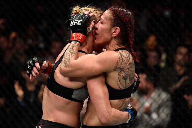 LAS VEGAS, NV - DECEMBER 30:  (R-L) Cris Cyborg of Brazil and Holly Holm hug after the conclusion after their women's featherweight bout during the UFC 219 event inside T-Mobile Arena on December 30, 2017 in Las Vegas, Nevada. (Photo by Jeff Bottari/Zuffa LLC/Zuffa LLC via Getty Images)