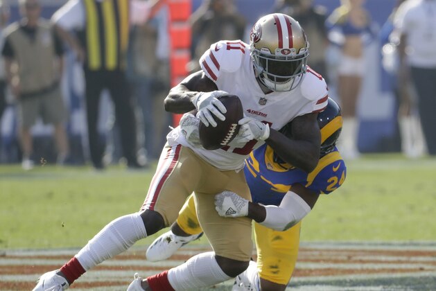 San Francisco 49ers wide receiver Marquise Goodwin, left, is tackled by Los Angeles Rams cornerback Blake Countess during the first half of an NFL football game Sunday, Dec. 31, 2017, in Los Angeles. (AP Photo/Rick Scuteri)