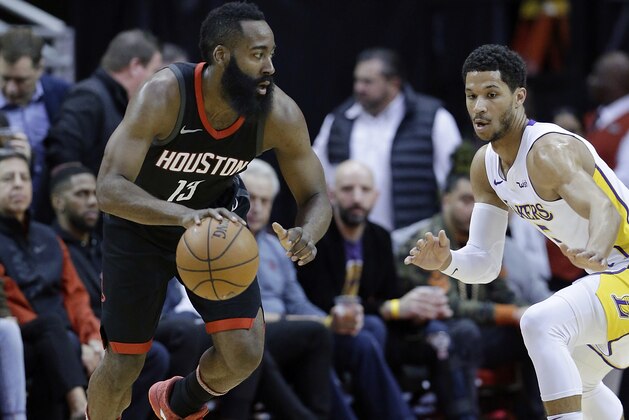 Houston Rockets guard James Harden (13) looks for a way around Los Angeles Lakers guard Josh Hart (5) in the first half of an NBA basketball game Sunday, Dec. 31, 2017, in Houston. (AP Photo/Michael Wyke)