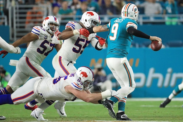 MIAMI GARDENS, FL - DECEMBER 31:  Quarterback David Fales #9 of the Miami Dolphins is pressured during the fourth quarter against the Buffalo Bills at Hard Rock Stadium on December 31, 2017 in Miami Gardens, Florida.  (Photo by Mike Ehrmann/Getty Images)