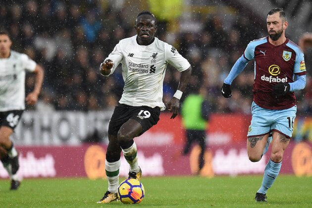 Liverpool's Senegalese midfielder Sadio Mane runs with the ball during the English Premier League football match between Burnley and Liverpool at Turf Moor in Burnley, north west England on January 1, 2018. / AFP PHOTO / Oli SCARFF / RESTRICTED TO EDITORIAL USE. No use with unauthorized audio, video, data, fixture lists, club/league logos or 'live' services. Online in-match use limited to 75 images, no video emulation. No use in betting, games or single club/league/player publications. / (Photo credit should read OLI SCARFF/AFP/Getty Images) Liverpool's Senegalese midfielder Sadio Mane runs with the ball during the English Premier League football match between Burnley and Liverpool at Turf Moor in Burnley, north west England on January 1, 2018. / AFP PHOTO / Oli SCARFF / RESTRICTED TO EDITORIAL USE. No use with unauthorized audio, video, data, fixture lists, club/league logos or 'live' services. Online in-match use limited to 75 images, no video emulation. No use in betting, games or single club/league/player publications. / (Photo credit should read OLI SCARFF/AFP/Getty Images)