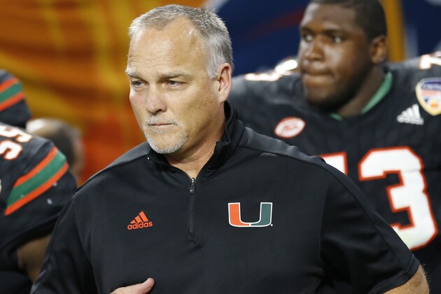 Miami head coach Mark Richt enter the field during the second half of the Orange Bowl NCAA college football game against Wisconsin, Saturday, Dec. 30, 2017, in Miami Gardens, Fla. (AP Photo/Joe Skipper)