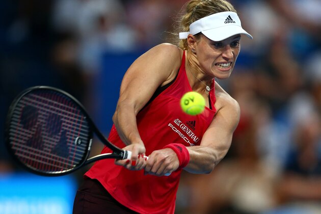 PERTH, AUSTRALIA - JANUARY 01:  Angelique Kerber of Germany plays a backhand to Elise Mertens of Belgium in the womens singles match on day 3 during the 2018 Hopman Cup at Perth Arena on January 1, 2018 in Perth, Australia.  (Photo by Paul Kane/Getty Images)