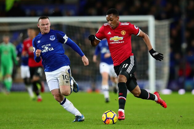 LIVERPOOL, ENGLAND - JANUARY 01: Anthony Martial of Manchester United and Wayne Rooney of Everton in action during the Premier League match between Everton and Manchester United at Goodison Park on January 1, 2018 in Liverpool, England.  (Photo by Chris Brunskill Ltd/Getty Images)