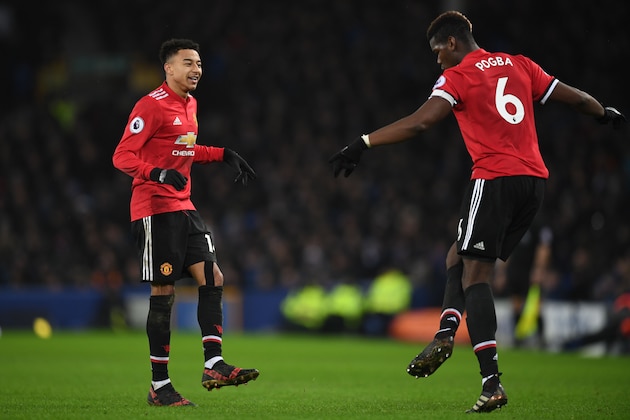 Manchester United's English midfielder Jesse Lingard (L) celebrates scoring the team's second goal with Manchester United's French midfielder Paul Pogba during the English Premier League football match between Everton and Manchester United at Goodison Park in Liverpool, north west England on January 1, 2018.  / AFP PHOTO / Paul ELLIS / RESTRICTED TO EDITORIAL USE. No use with unauthorized audio, video, data, fixture lists, club/league logos or 'live' services. Online in-match use limited to 75 images, no video emulation. No use in betting, games or single club/league/player publications.  /         (Photo credit should read PAUL ELLIS/AFP/Getty Images)