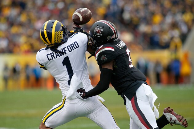 TAMPA, FL - JANUARY 1:  Defensive back Chris Lammons #3 of the South Carolina Gamecocks*breaks up a pass intended for wide receiver Kekoa Crawford #1 of the Michigan Wolverines during the first quarter of the Outback Bowl NCAA college football game on January 1, 2018 at Raymond James Stadium in Tampa, Florida. (Photo by Brian Blanco/Getty Images)