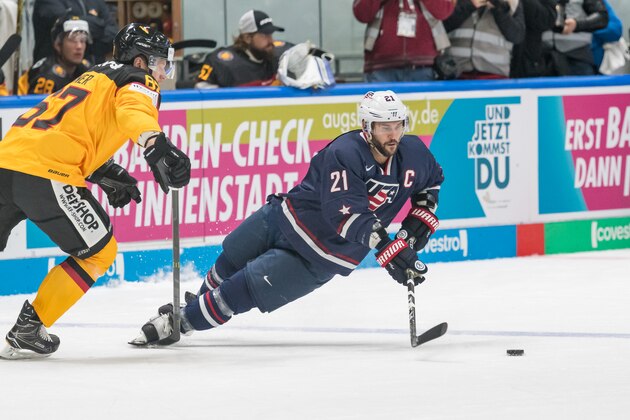AUGSBURG, GERMANY - NOVEMBER 12: Bernhard Ebner of Germany and Brian Gionta of USA battle for the ball during the Deutschland Cup 2017 match between Germany and USA at Curt-Frenzel-Stadion on November 12, 2017 in Augsburg, Germany. (Photo by TF-Images/TF-Images via Getty Images)