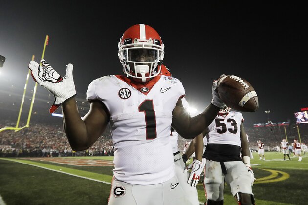 Georgia tailback Sony Michel (1) celebrates after scoring the game-winning touchdown in the second overtime period to give Georgia a 54-48 win over Oklahoma in the Rose Bowl NCAA college football game, Monday, Jan. 1, 2018, in Pasadena, Calif (AP Photo/Doug Benc)