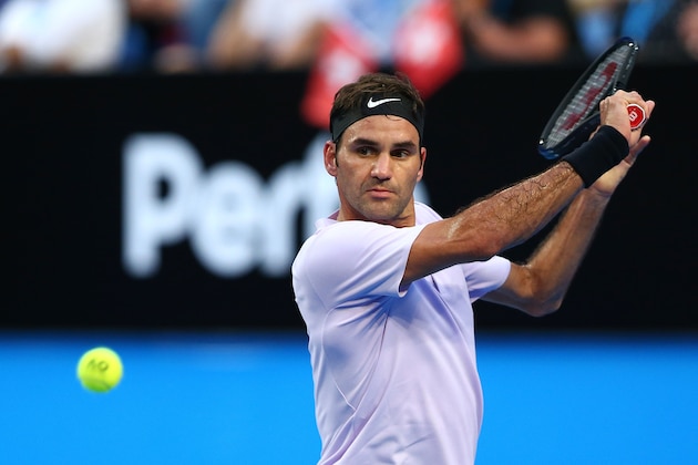 PERTH, AUSTRALIA - JANUARY 02: Roger Federer of Switzerland plays a backhand to Karen Khachanov of Russia in the mens singles match on Day Four of the 2018 Hopman Cup at Perth Arena on January 2, 2018 in Perth, Australia.  (Photo by Paul Kane/Getty Images)
