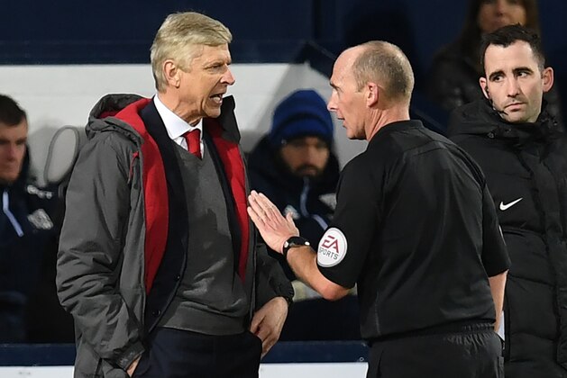 Arsenal's French manager Arsene Wenger (L) has words with English referee Mike Dean during the English Premier League football match between West Bromwich Albion and Arsenal at The Hawthorns stadium in West Bromwich, central England, on December 31, 2017.
 / AFP PHOTO / Paul ELLIS / RESTRICTED TO EDITORIAL USE. No use with unauthorized audio, video, data, fixture lists, club/league logos or 'live' services. Online in-match use limited to 75 images, no video emulation. No use in betting, games or single club/league/player publications.  /         (Photo credit should read PAUL ELLIS/AFP/Getty Images)